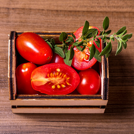 wooden-box-with-tomatoes-oregano-twig 1